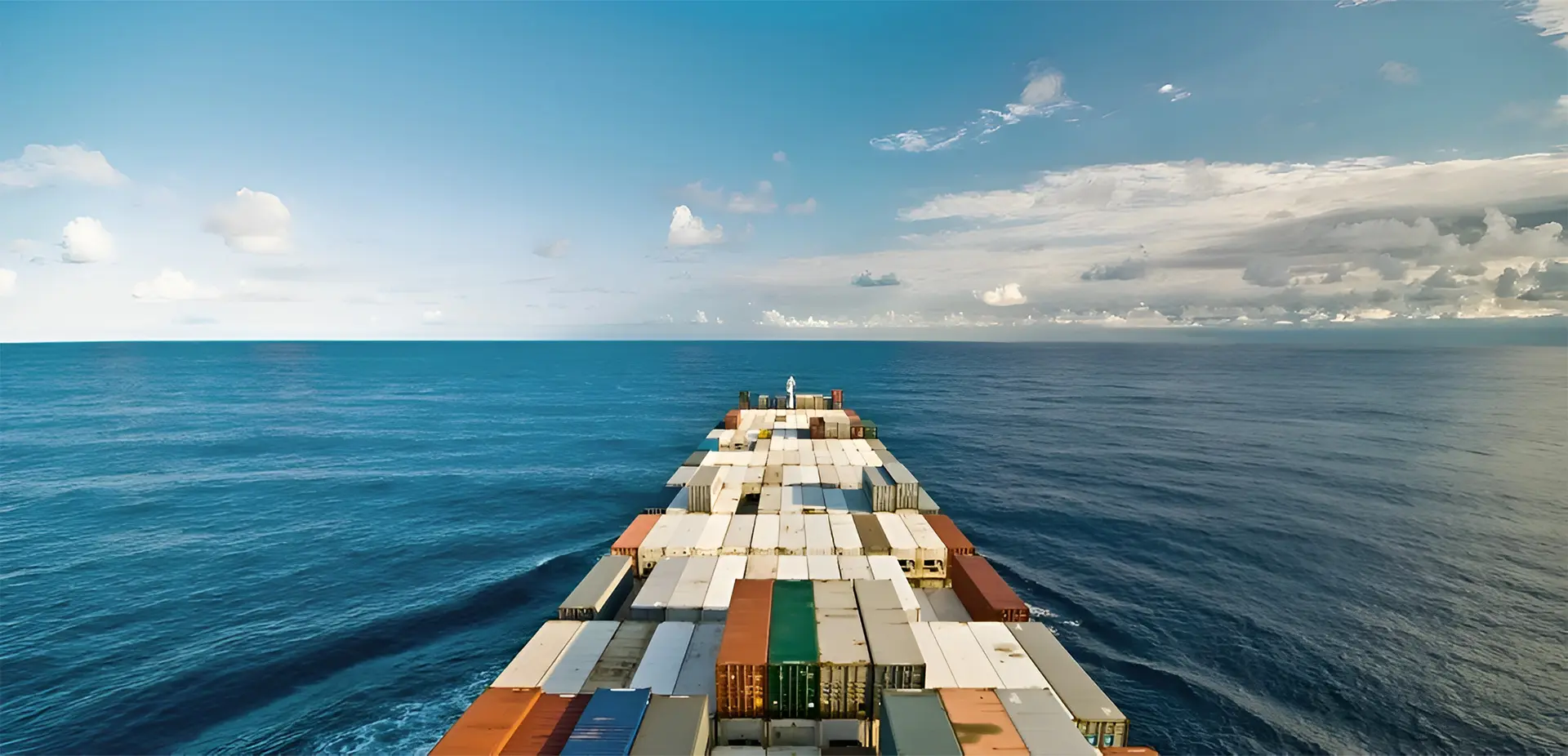 A large cargo ship sailing on the ocean.