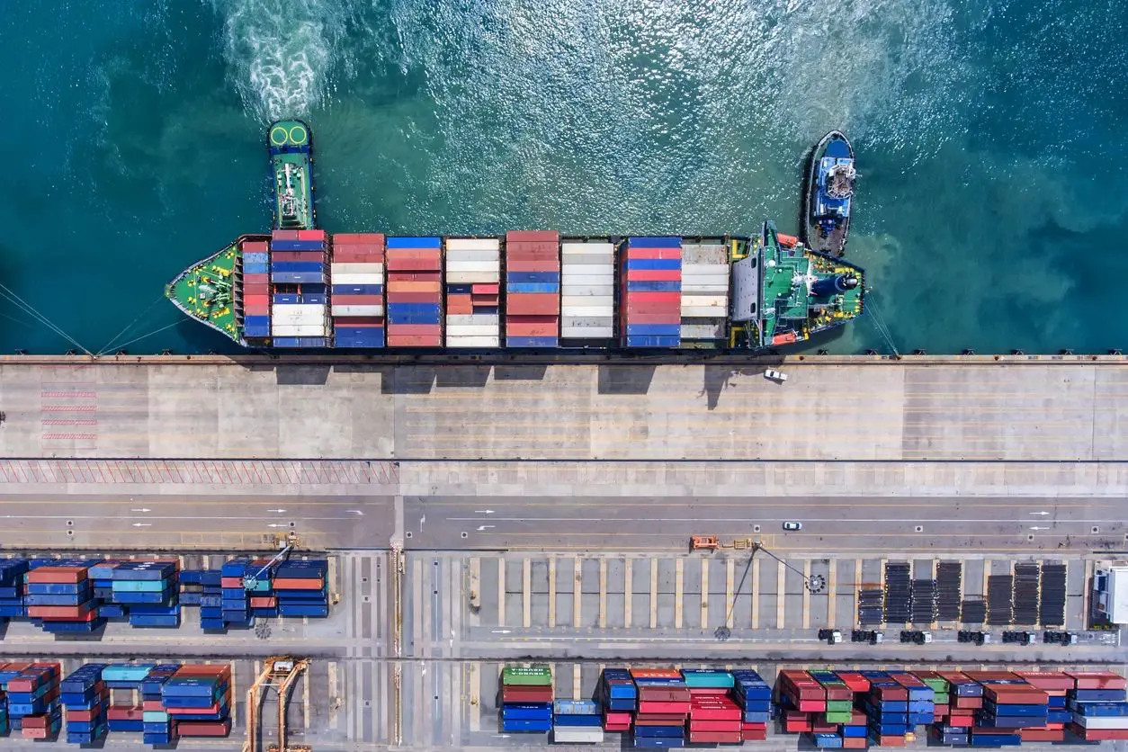 A large cargo ship is docked at the dock.